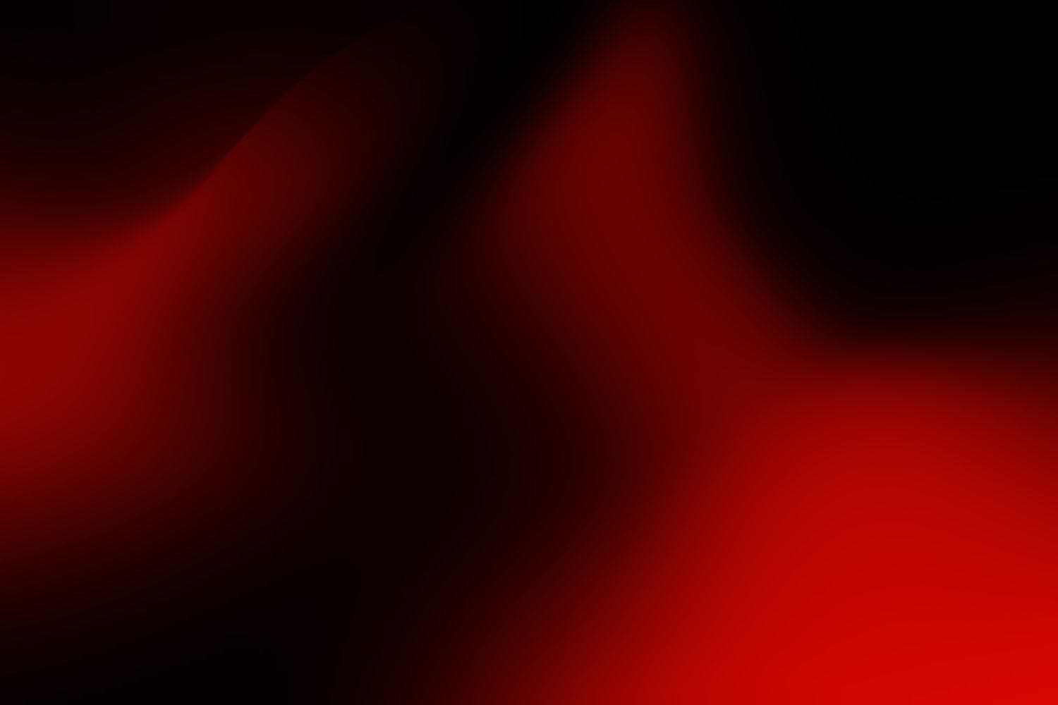 Abstract study in deep red and black: two soft forms meeting in light.